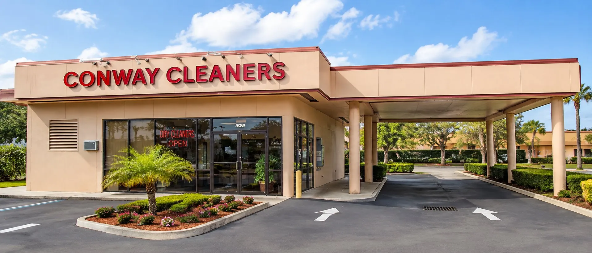 The Conway Cleaners storefront on Curry Ford Road, with its covered drive-through lanes
